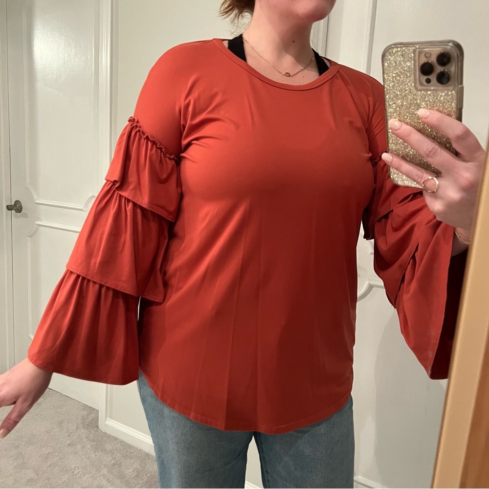 Entro brand, size large, long sleeve top with tiered ruffle sleeves